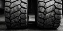 Close-up view of a forklift's heavy-duty tires and how tire condition impacts productivity & safety.