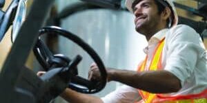 engineer staff male warehouse worker in hard hat working. walking through logistics center warehouse factory construction site logistics architect forklife driver man builder indoors background