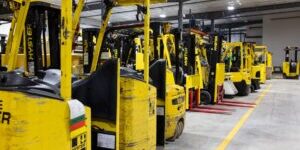 Used forklift in warehouse ready for material handling operations